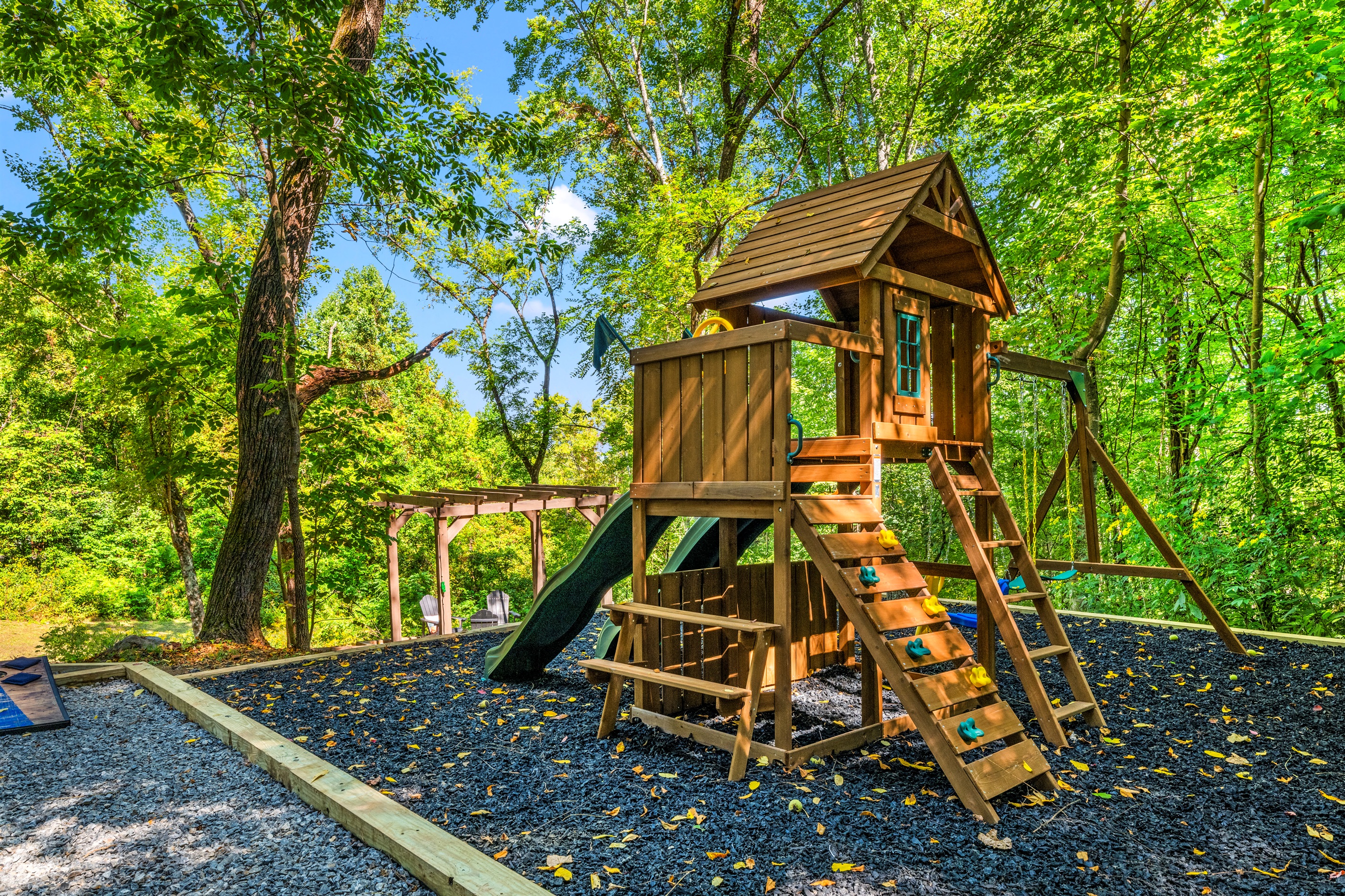 🌲 Climb, swing, zip down, repeat. This custom play set blends right into the forest—but your kids will never want to leave it.