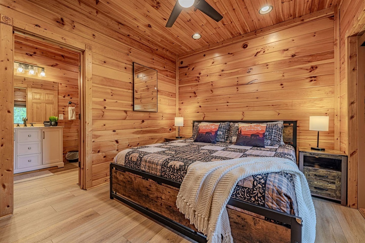 King bedroom 2 &mdash; main floor king with private en-suite bath. The Crown Jewel has five king bedrooms across five levels. Gatlinburg Falls Resort.