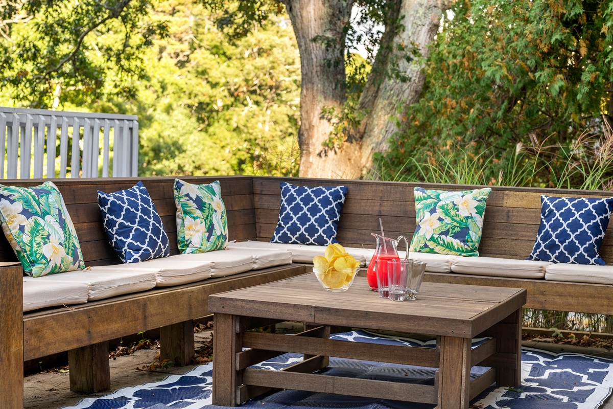 An outdoor sitting area designed for both relaxation and conversation, surrounded by the beauty of nature.