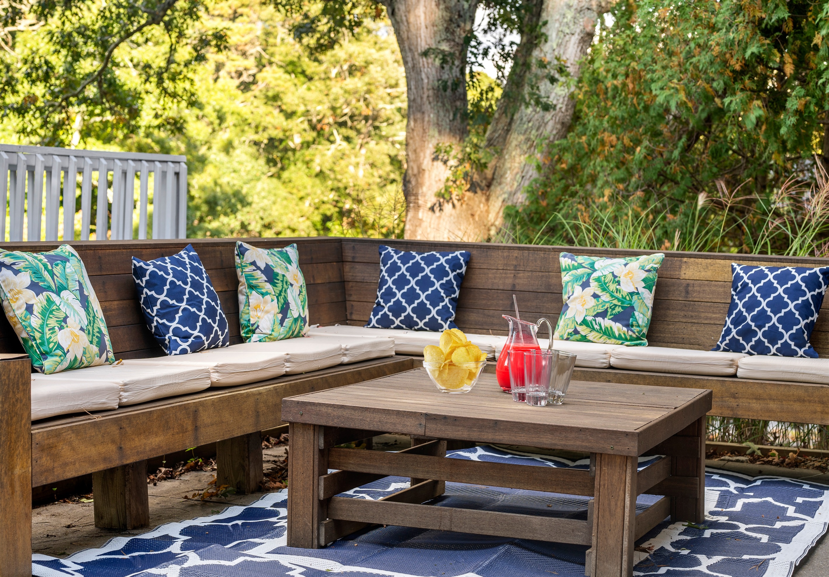 An outdoor sitting area designed for both relaxation and conversation, surrounded by the beauty of nature.