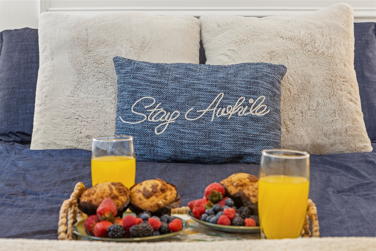Queen Bedroom 2: Relax amidst plush pillows and fresh fruit, a perfect start to your getaway!