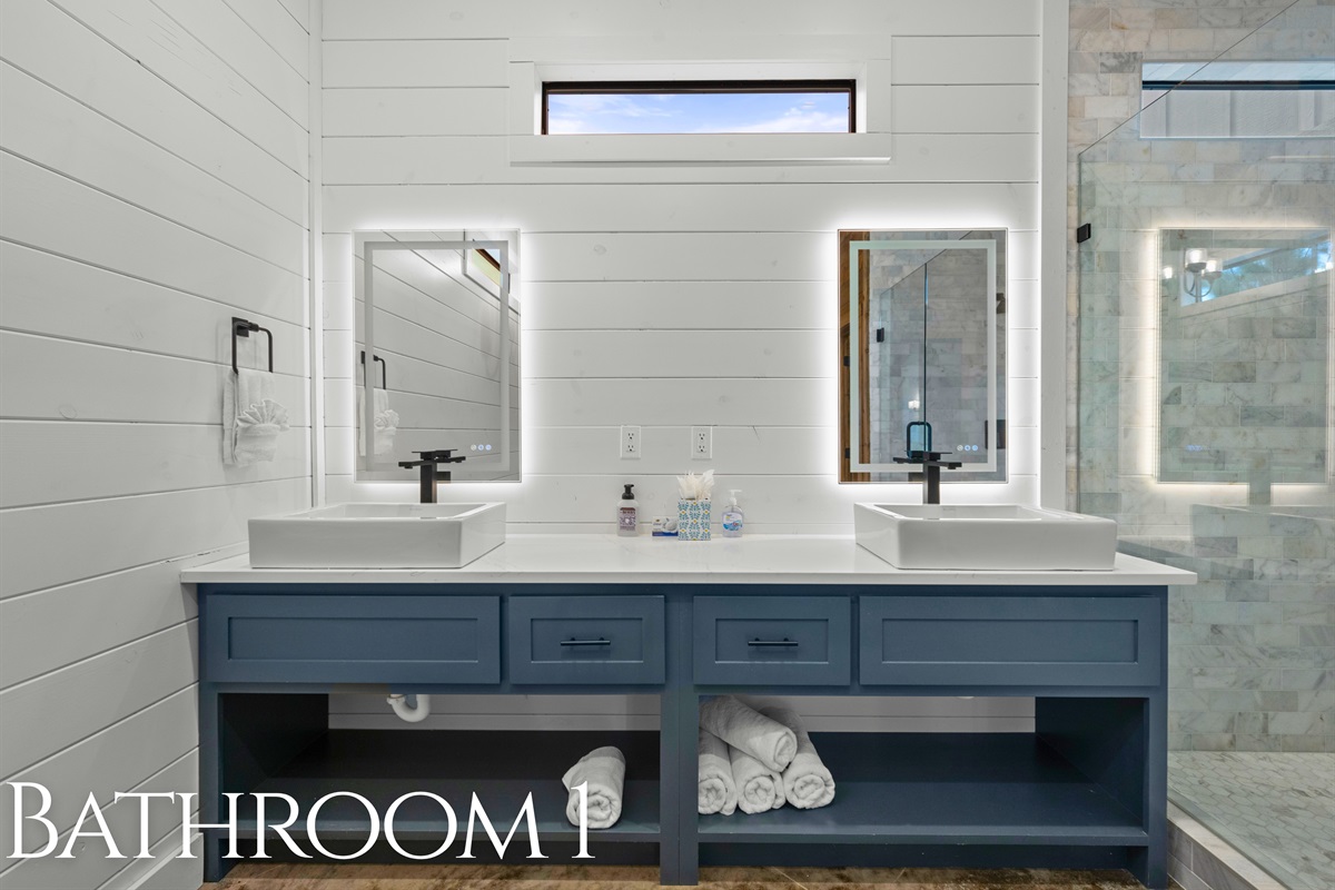 Bathroom 1 with dual sinks and modern finishes.