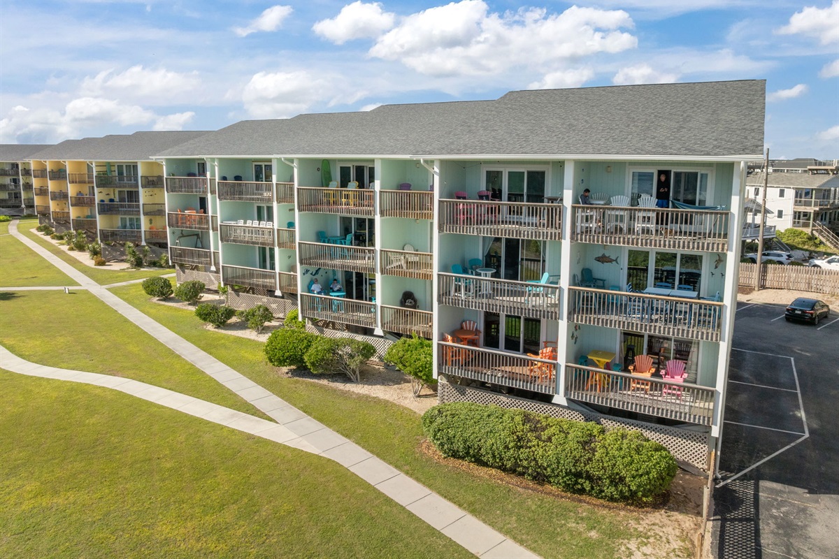 Coastal-style building with spacious balconies perfect for relaxing outdoors