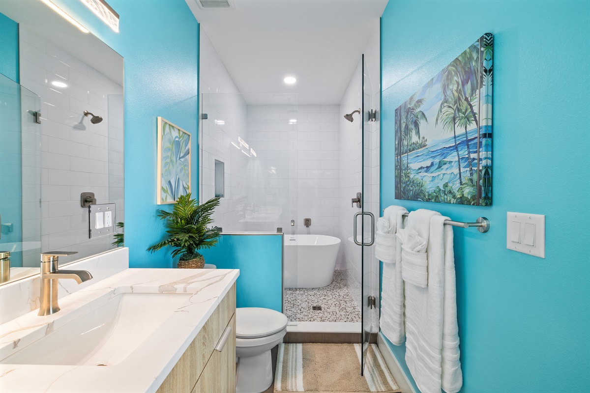 Bunkroom private bathroom with bathtub and shower