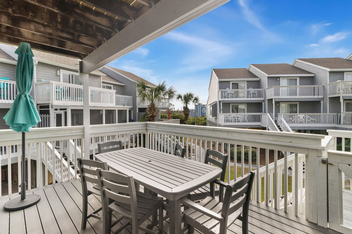 Find Dinner under the market umbrella with the Gulf breeze coming through &mdash; this Polywood table handles meals, card games, and morning coffee with equal ease.	