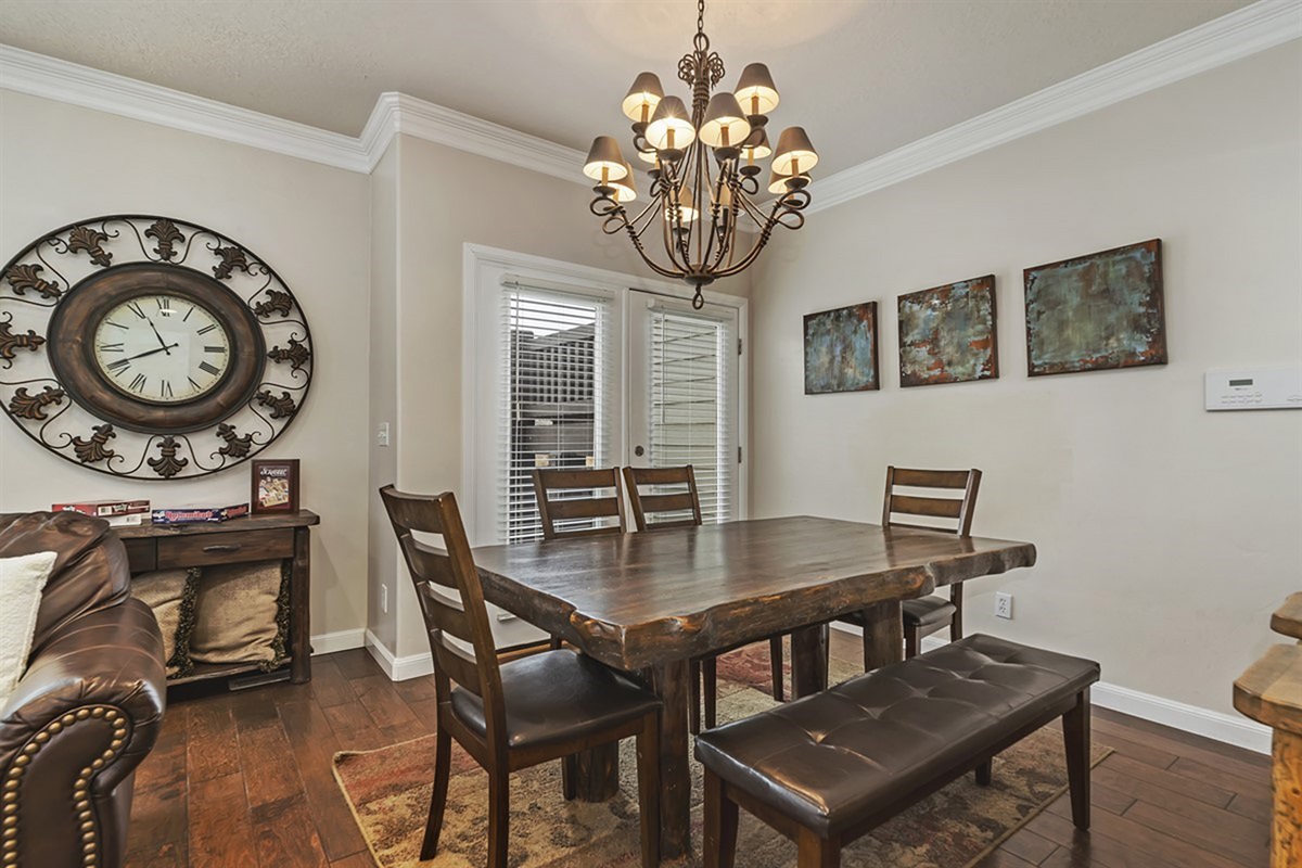 A spacious dining area with elegant lighting and seating for the whole group, perfect for memorable meals and gatherings.