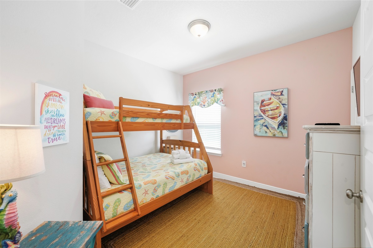 Bedroom 3: Twin-over-full bunk bed, Smart TV, dresser, and closet