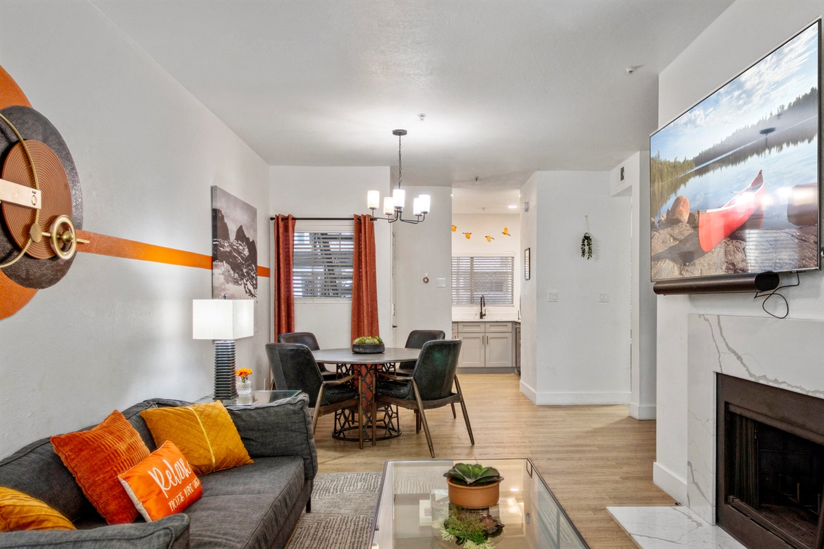 Designed with comfort and convenience in mind, this bright open-concept space is ideal for remote work, movie nights, socializing, or simply unwinding after a long day.