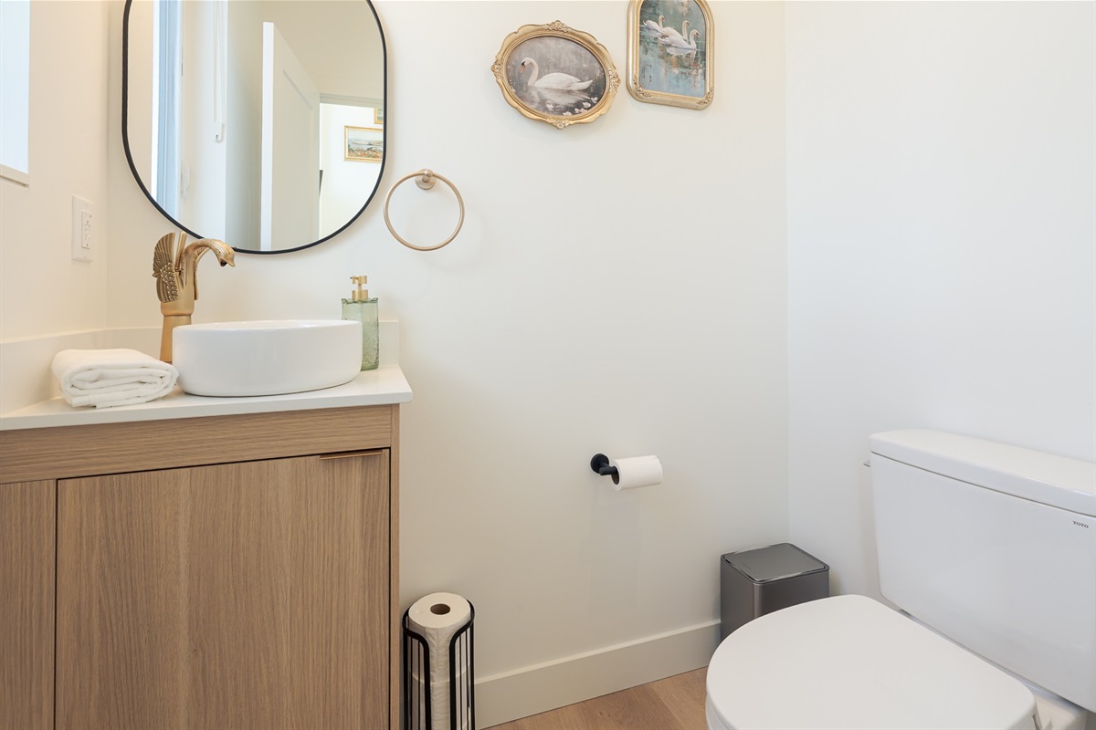 This half bath is located on the main floor next to the living room.