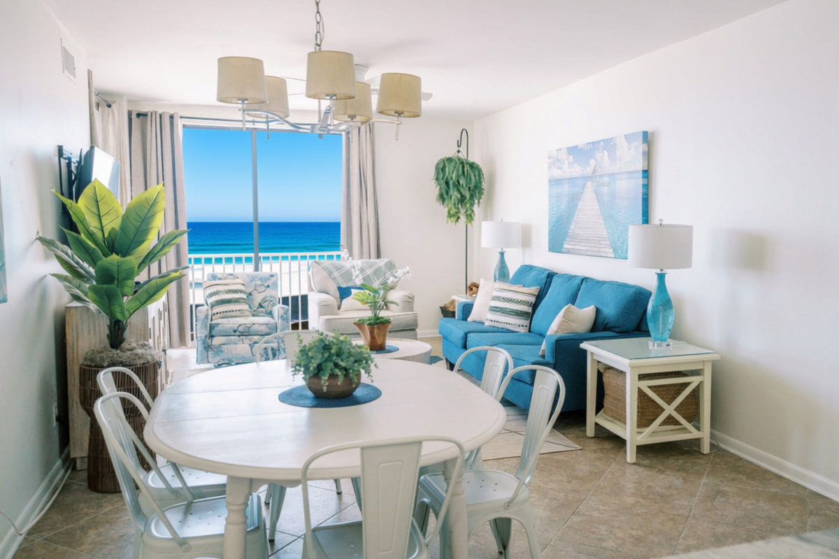 Open living space with comfortable seating and easy access to the beachfront balcony.