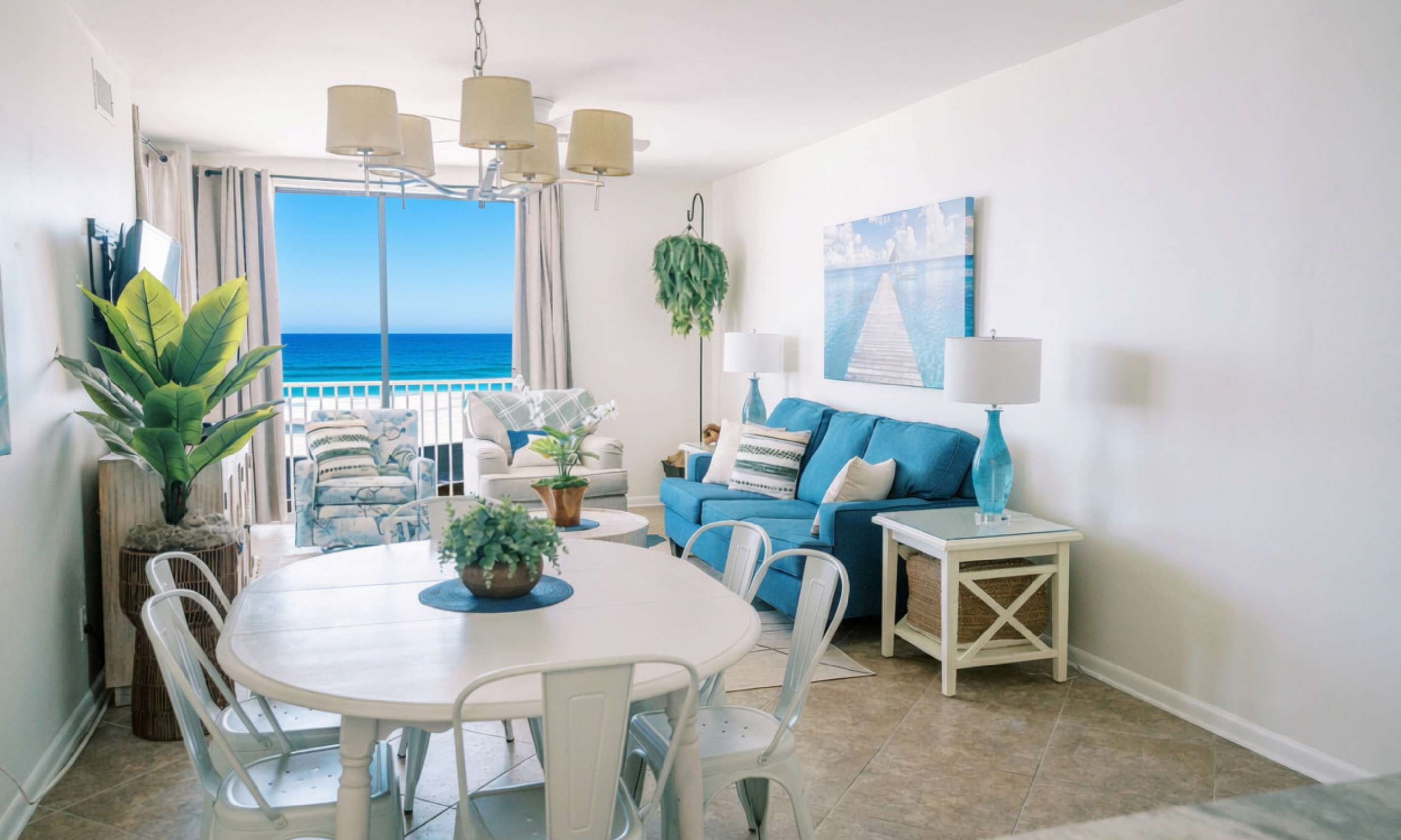 Open living space with comfortable seating and easy access to the beachfront balcony.