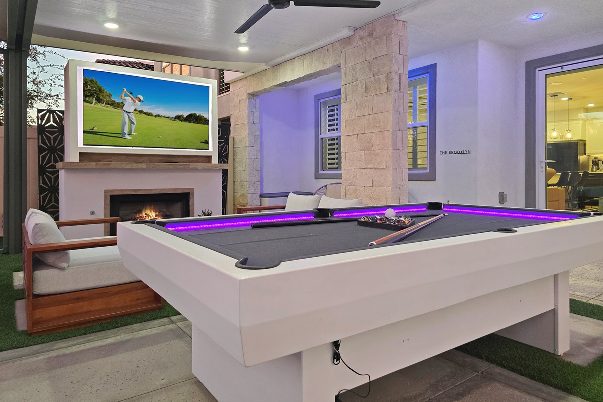 Outdoor Entertainment: Enjoy endless fun with a stylish pool table and a vibrant gathering space!