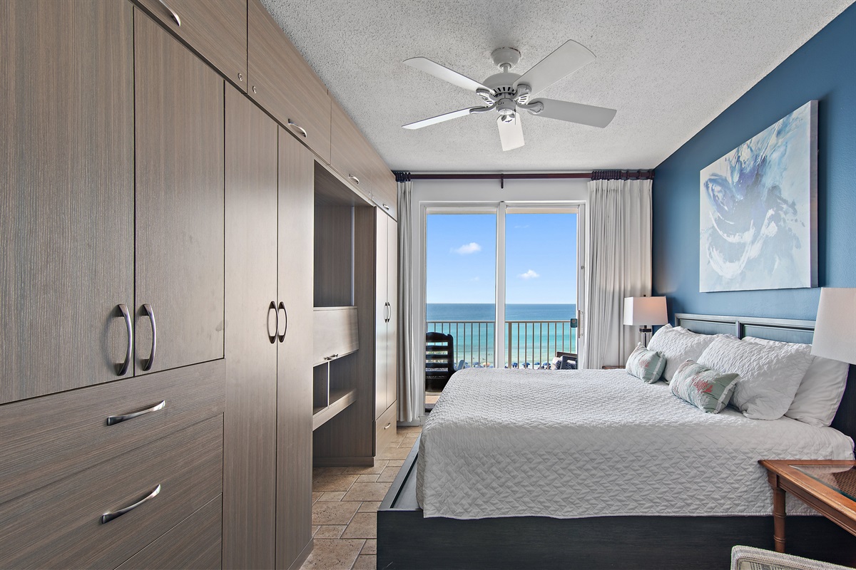 Spacious master bedroom features a King bed, Gulf views, balcony access, SMART TV w/ cable access, remodeled bathroom with walk in shower, and large closet.