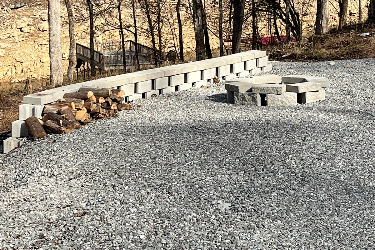 fire pit with plenty of play space around it directly across from the property