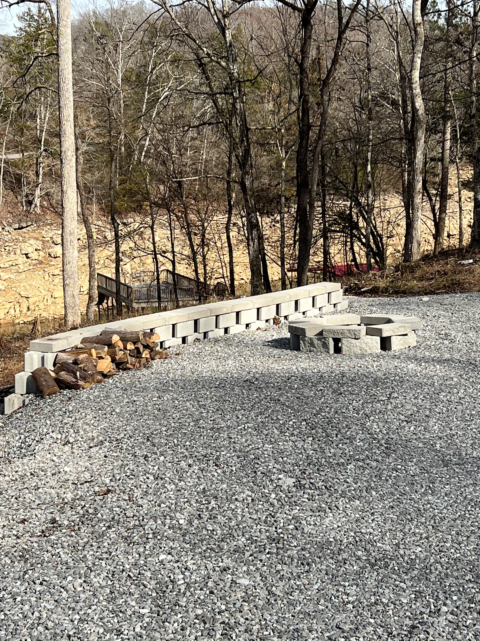 fire pit with plenty of play space around it directly across from the property
