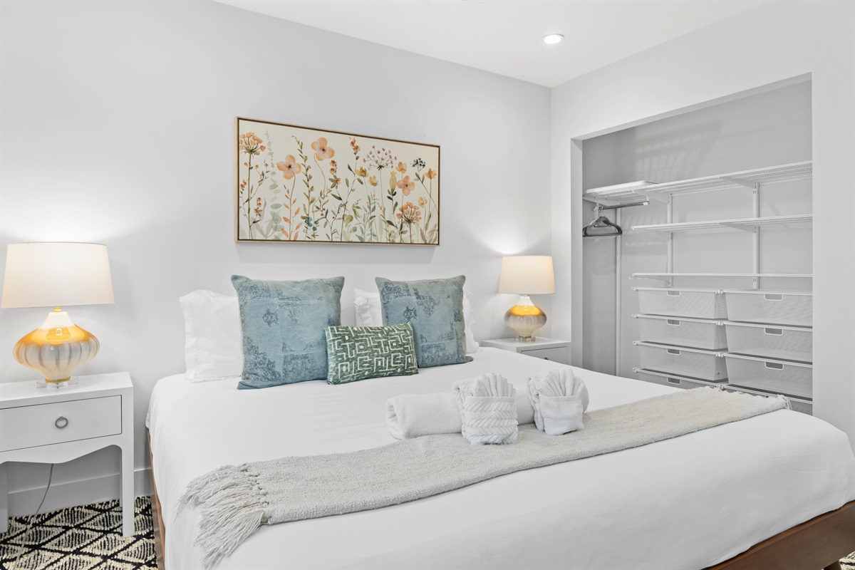 Wake up refreshed in this bright and airy retreat featuring a luxurious king bed and elegant modern décor.