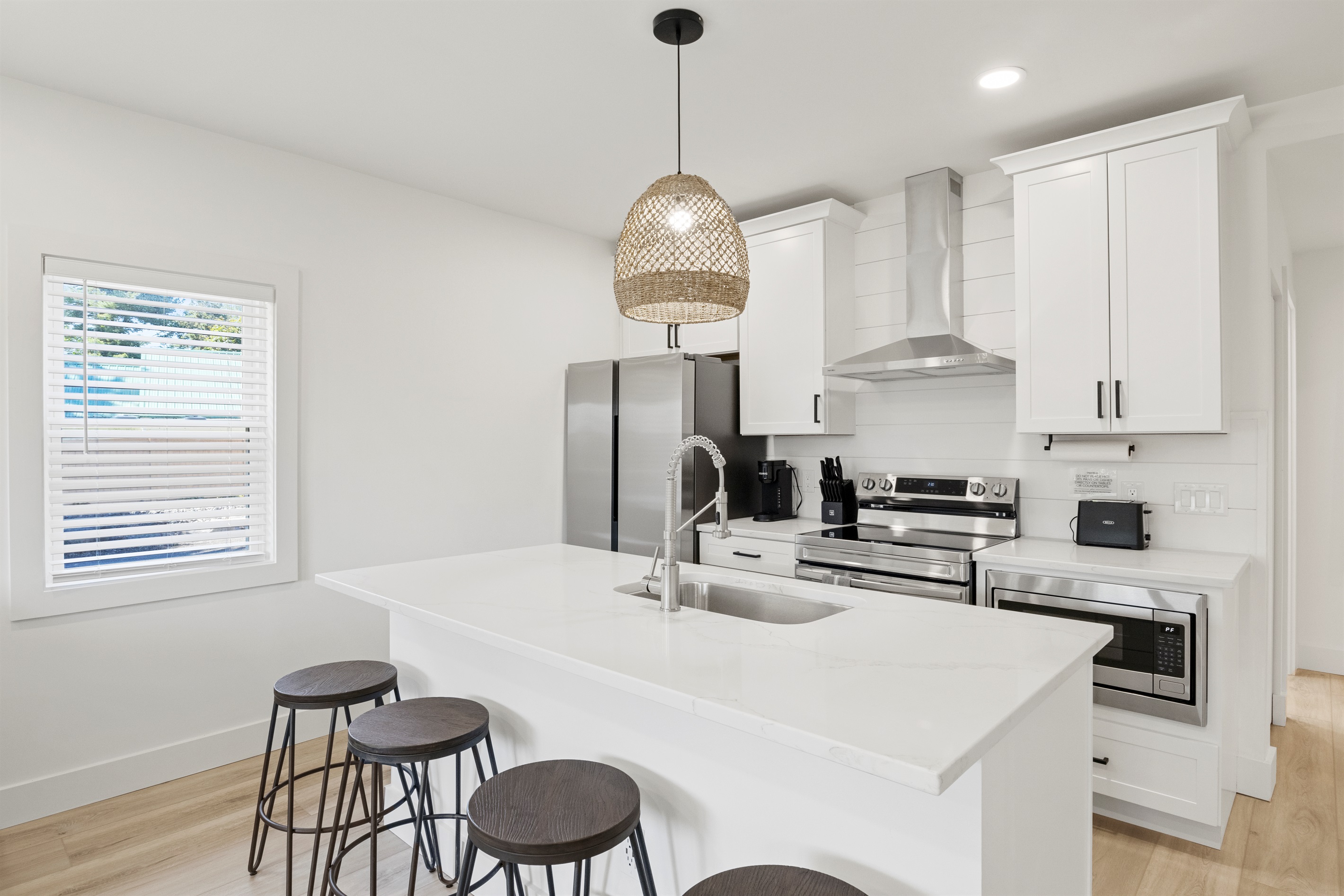 Kitchen island has 4 stools 