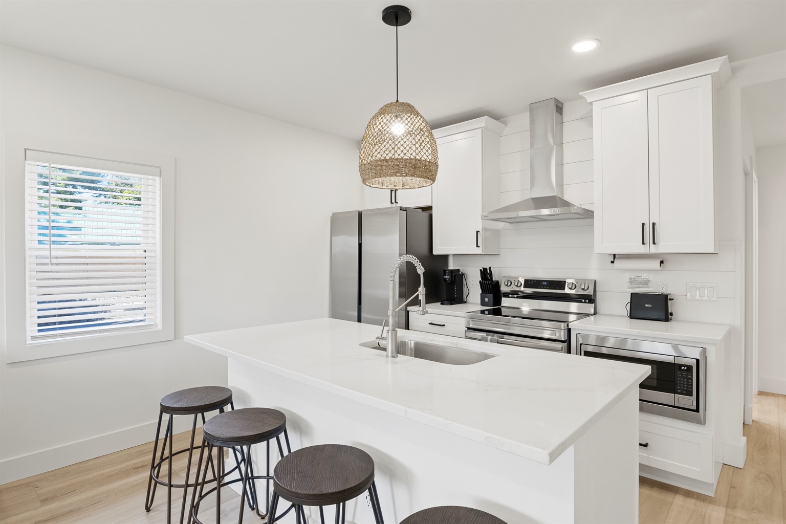 Kitchen island has 4 stools 