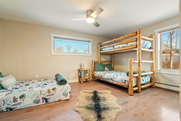 Spacious bedroom for kids or multi-family stays with bunk bed and double bed.
