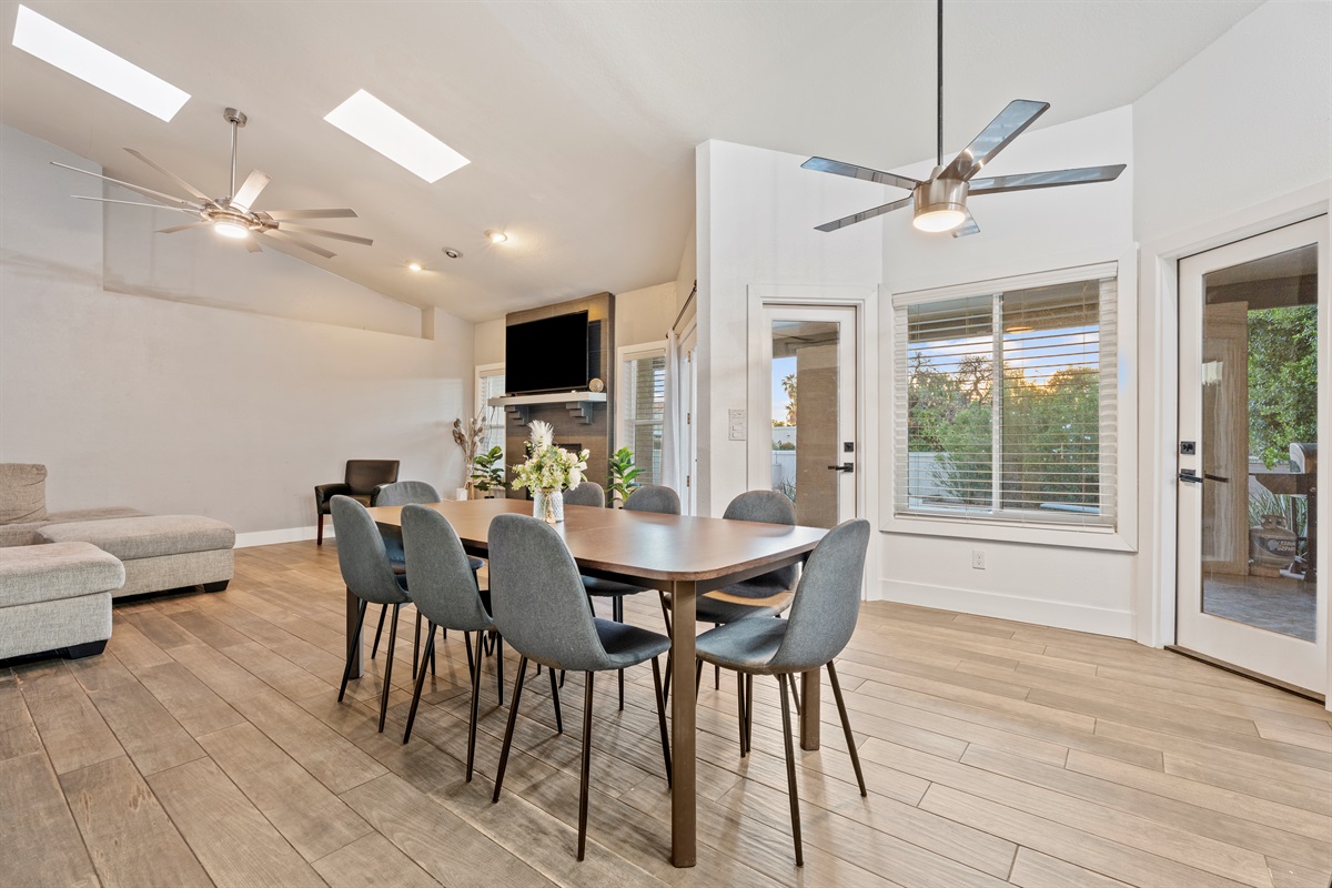 Gather around for breakfast or dinner in this open dining area with stylish seating and space for the whole crew.