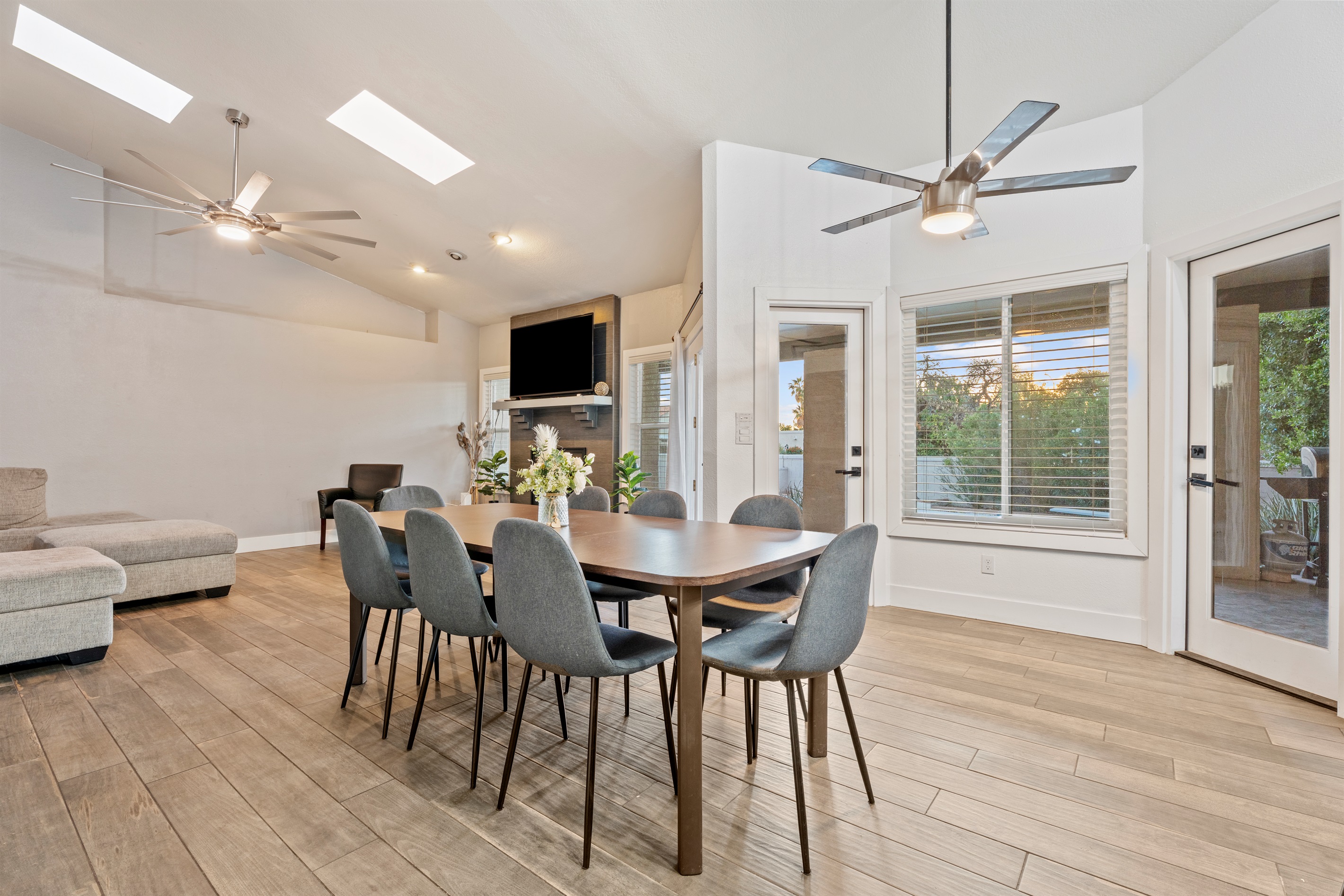 Gather around for breakfast or dinner in this open dining area with stylish seating and space for the whole crew.