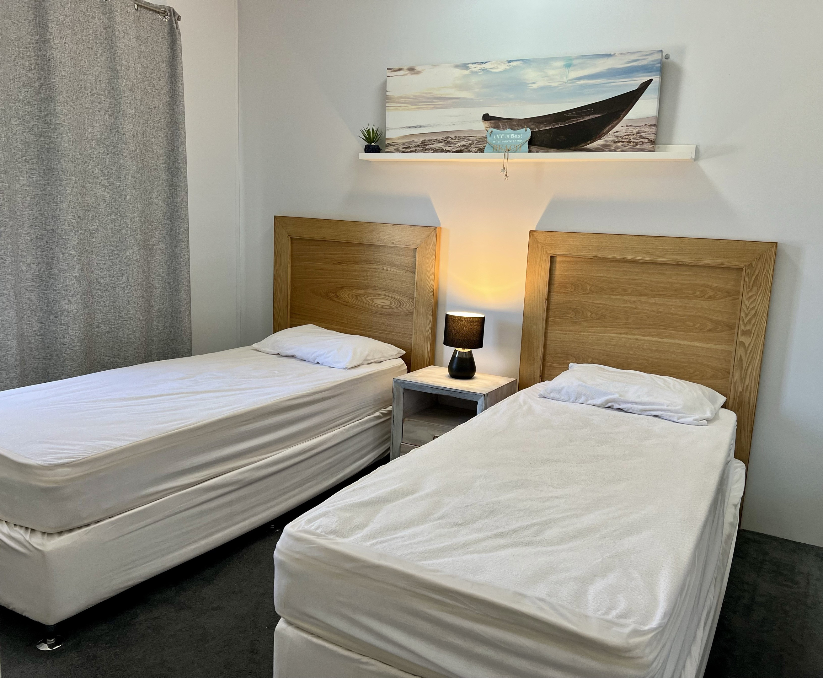 Bedroom Two with 2 single beds & built-in robe