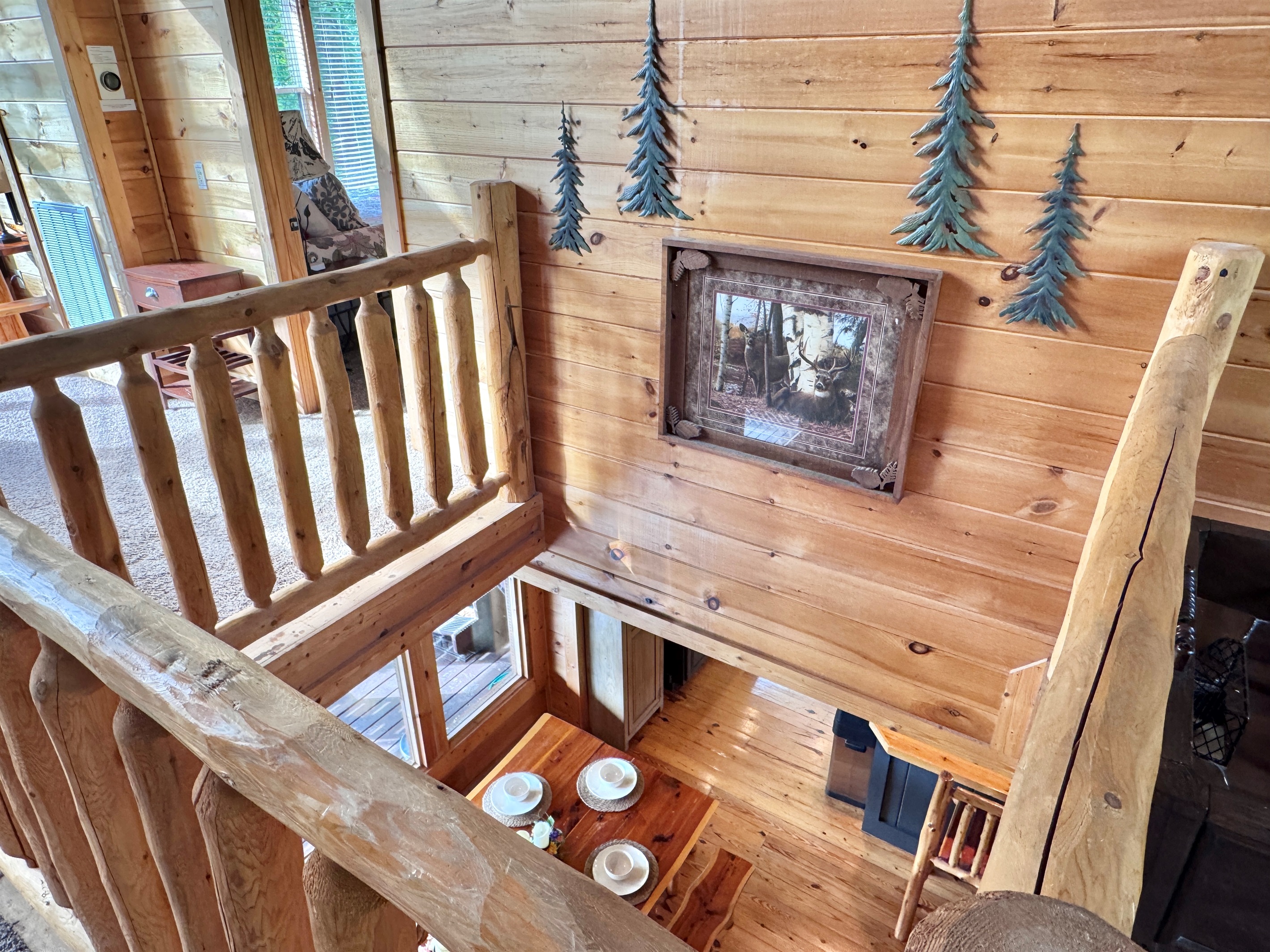 Unique cabin design, upper floor open to main level.