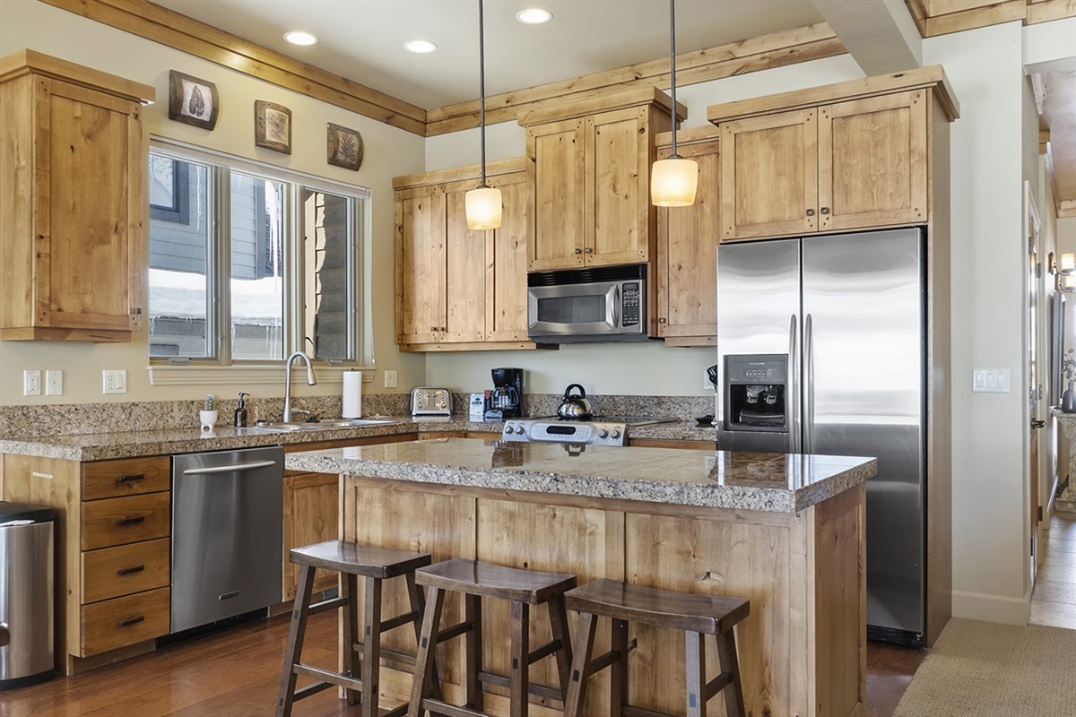 Gather around the island for coffee, conversation, or casual dining before heading out for the day.