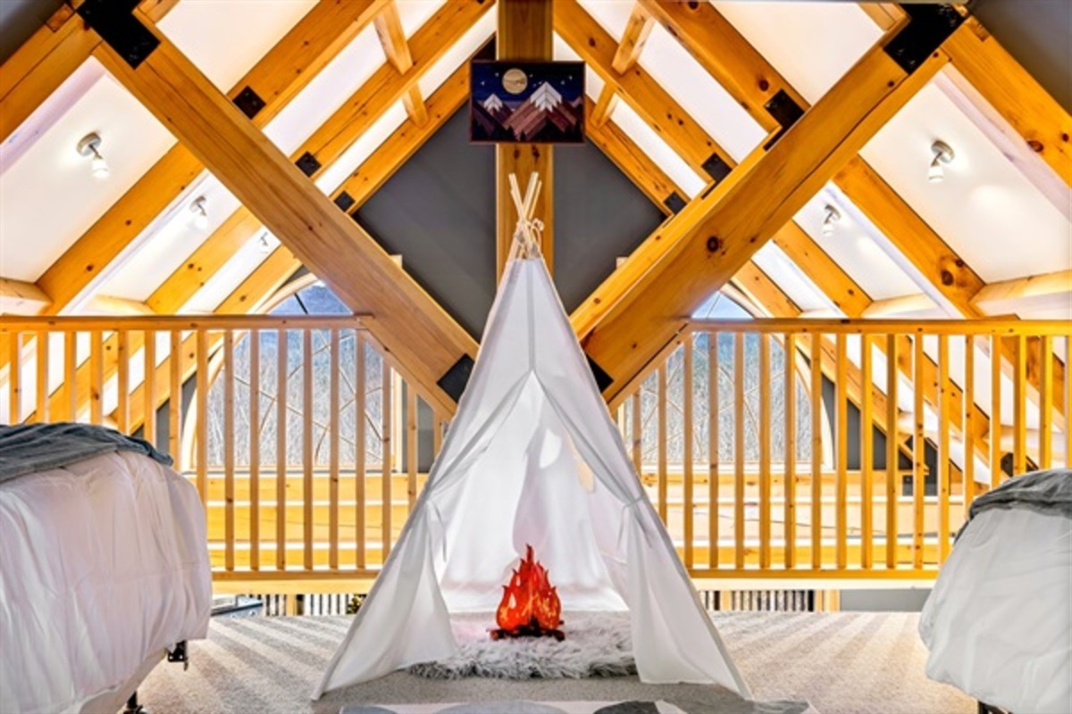 Turn bedtime into an adventure with a playful loft tent and faux campfire that kids and kids at heart love.