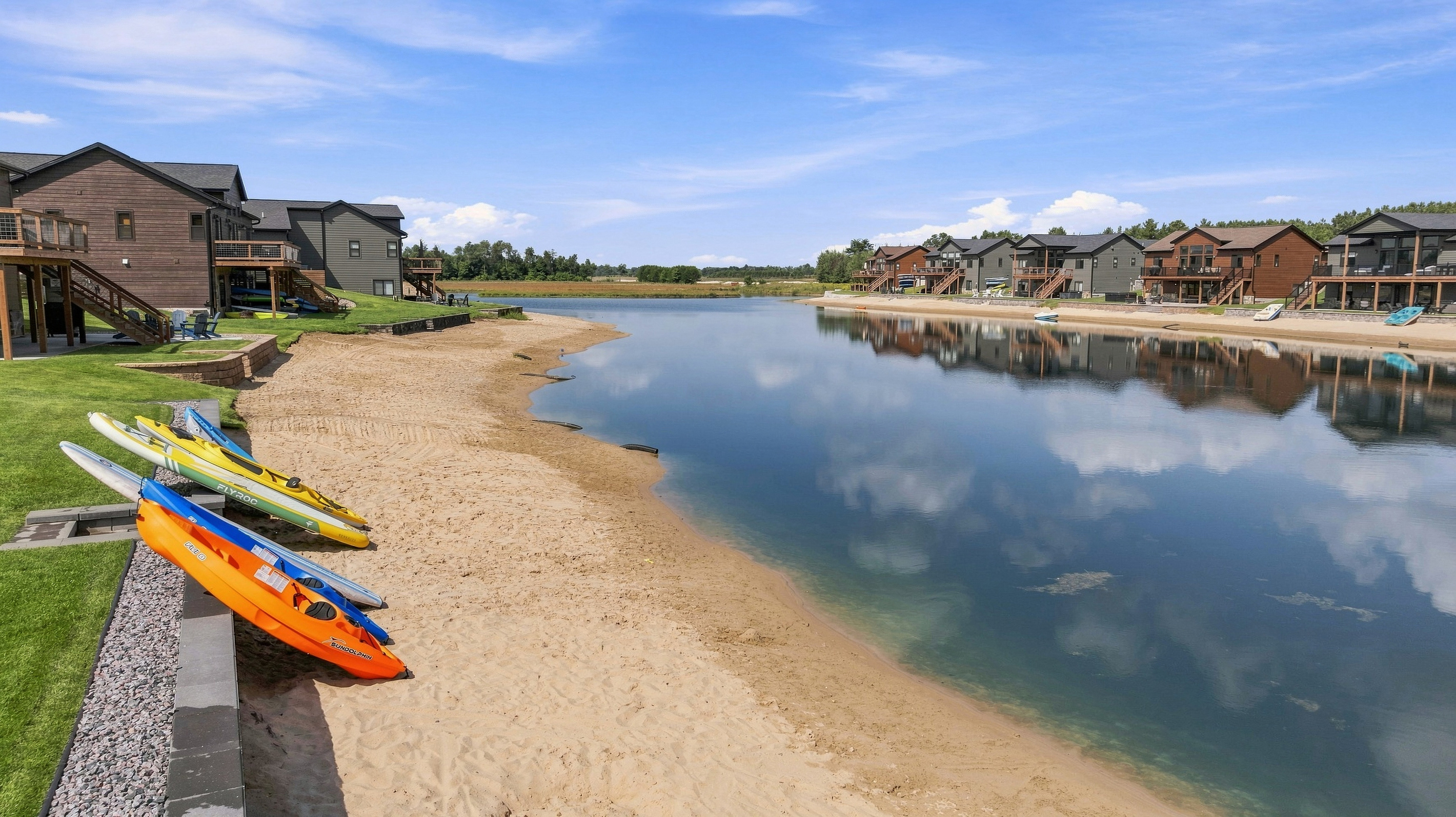back lake area with kayaks and paddle boards for your stay