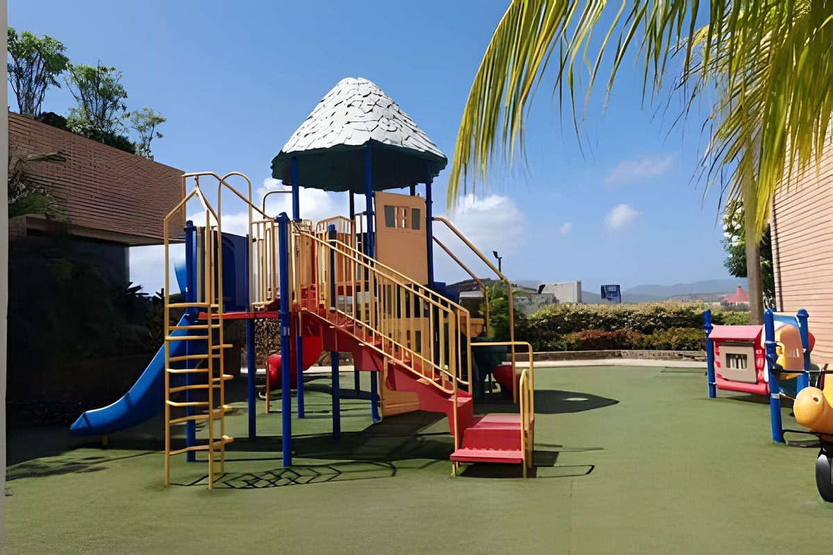 A vibrant playground full of slides and play structures for endless fun.