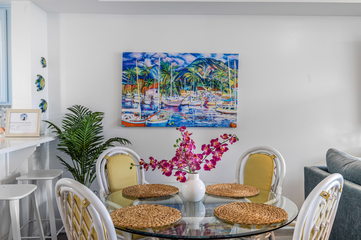 Dining area with table seating for 4 and 3 bar stools.