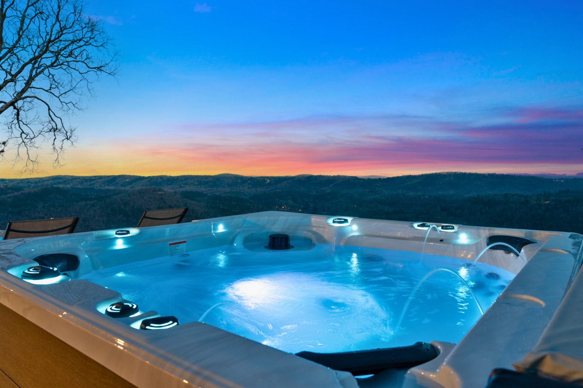End your day in the hot tub beneath a painted sunset sky, letting the warm water and quiet setting melt your worries away.