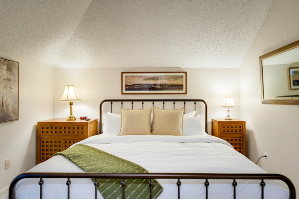 Settle into a king bed dressed in Pottery Barn sheets, duvet, blankets, and pillows for a comfortable night’s rest.