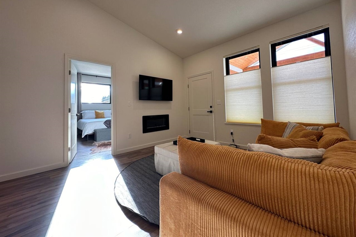 The living room has an electric fireplace with remote.  Two heat settings and a fun variety of flames.   The LG smart TV allows logging into your favorite streaming apps. The mount allow for different viewing angles.