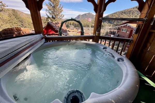 Soak under the covered gazebo with sweeping views of the valley and peaks.