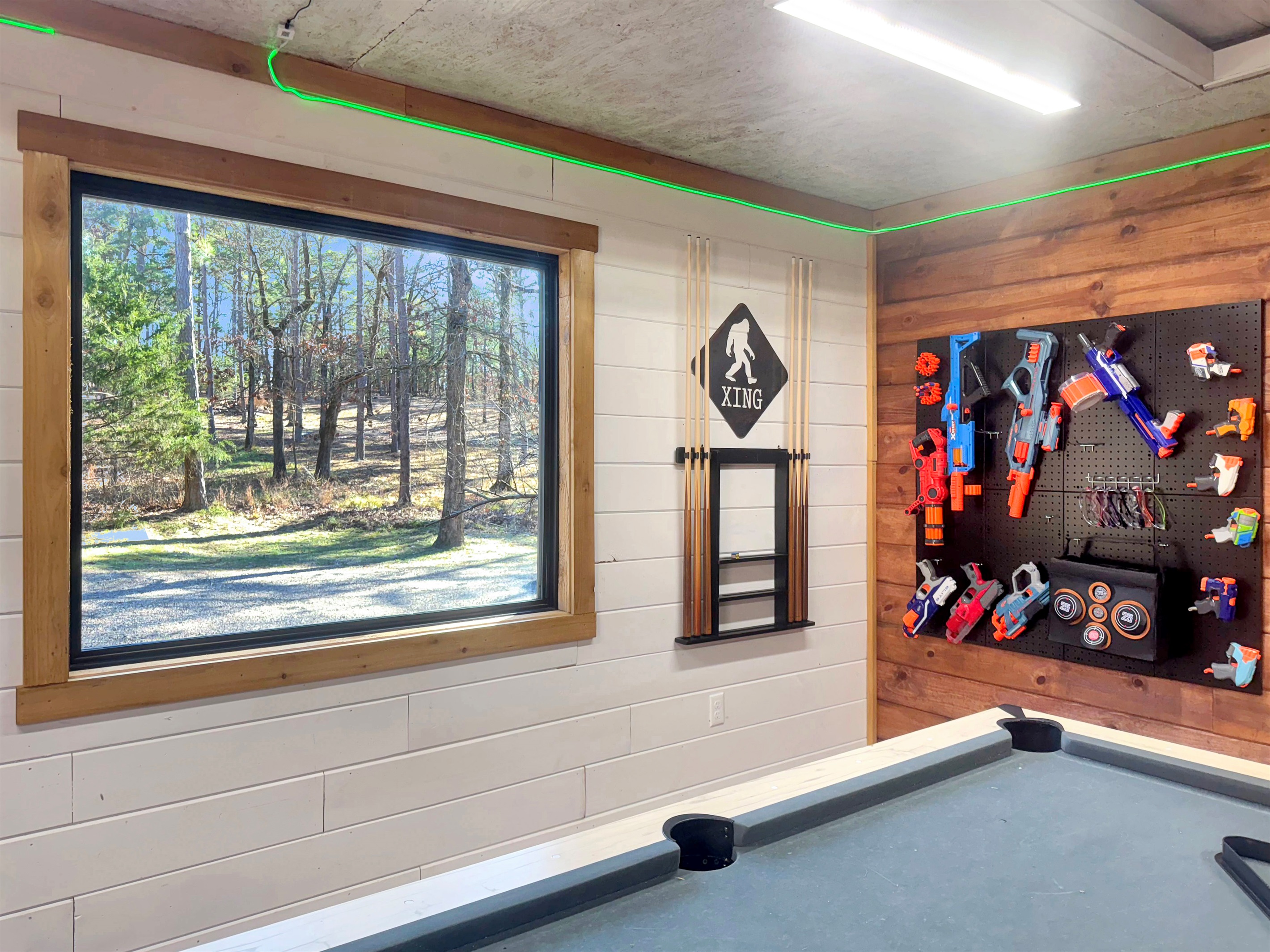 Game shed with view out to the driveway.