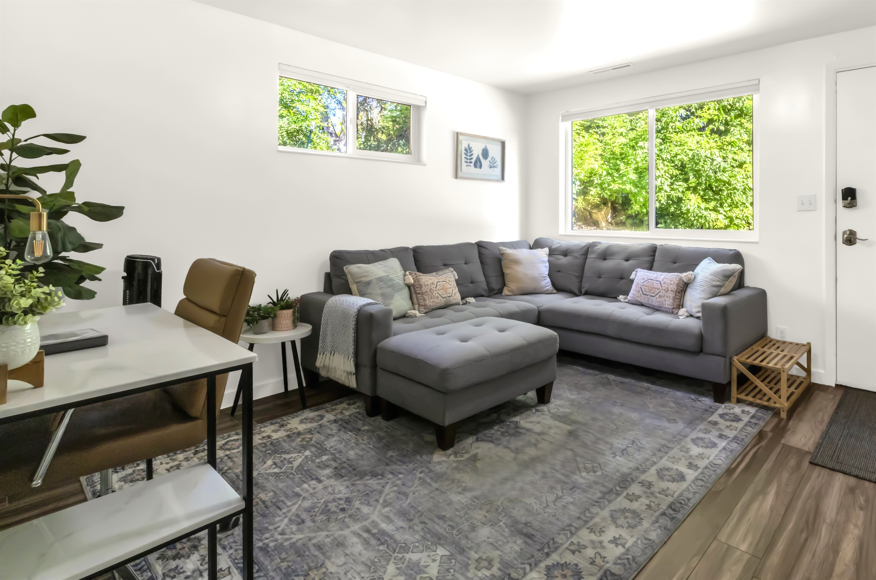 Bright and cozy living room with workspace