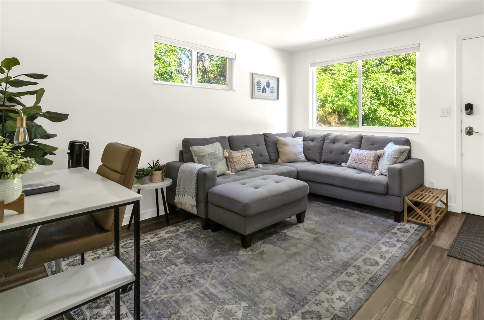 Bright and cozy living room with workspace