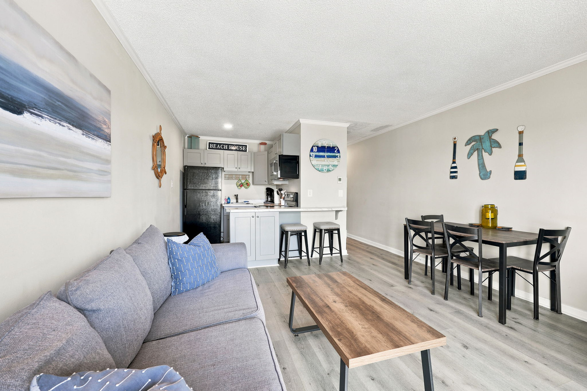 Share meals, morning coffee, and vacation conversations in the cozy dining area overlooking the open living space