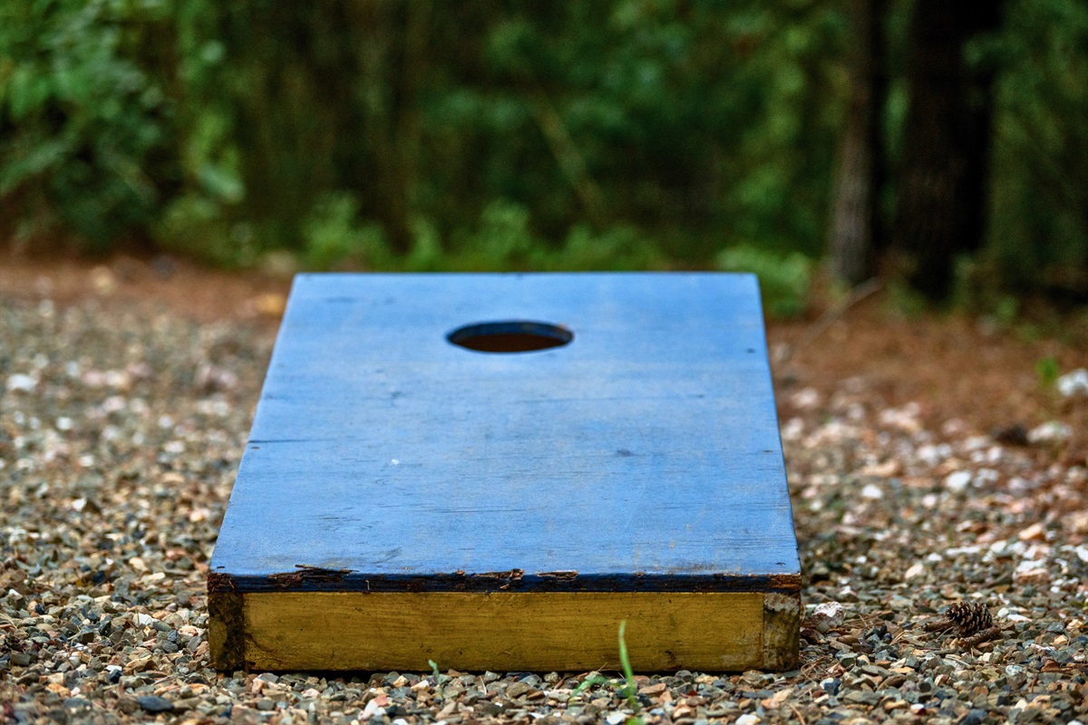 Challenge your group to a round of cornhole right outside the cabin—friendly competition encouraged.