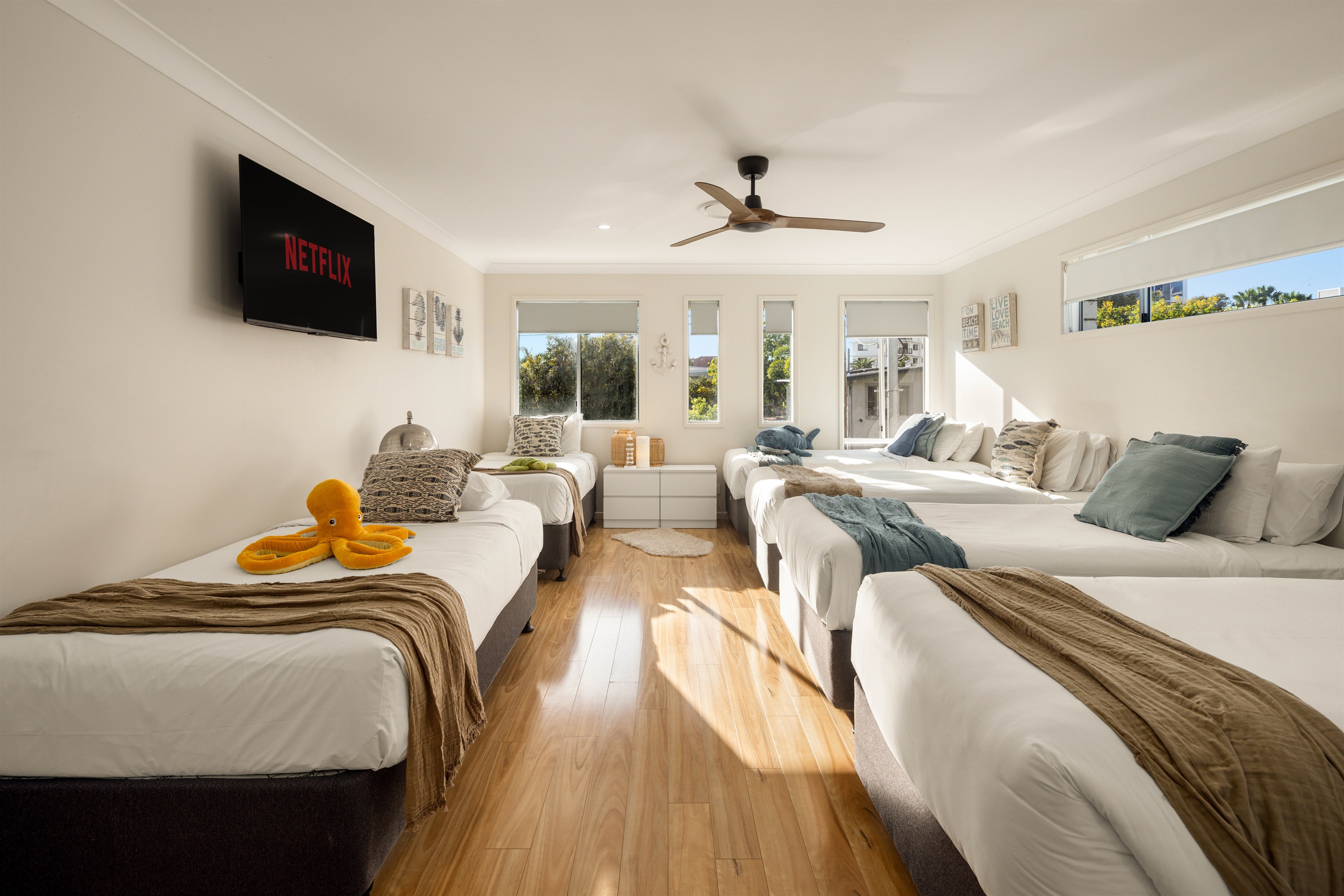 Expansive family Suite 5 offering flexible king or single configurations with abundant natural light.