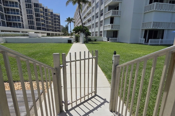 Gate to beach looking at the building