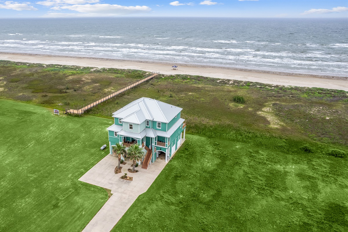 Located just a few feet from a private beach walkway.