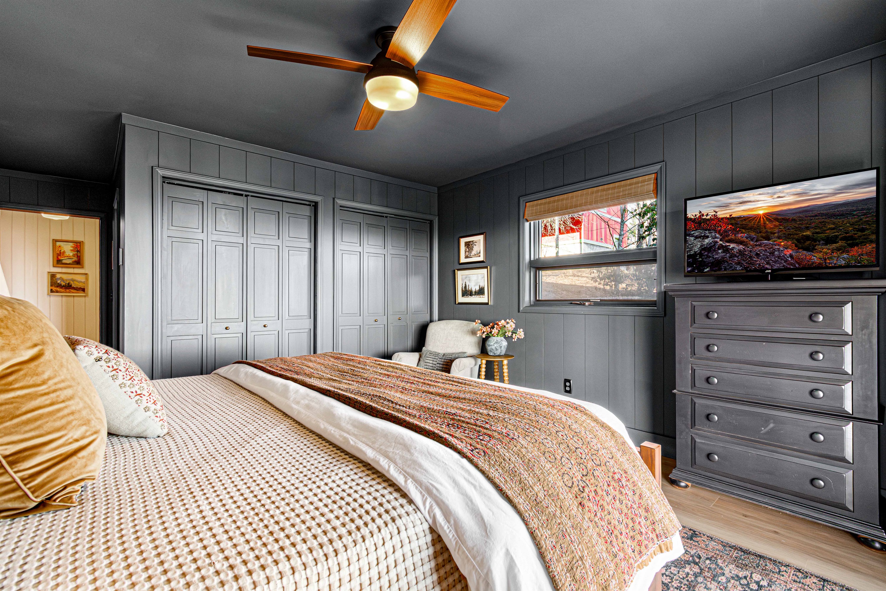 A spacious king bed anchors the Bear Room, complemented by soft lighting, thoughtful furnishings, and a layout that balances comfort with privacy.