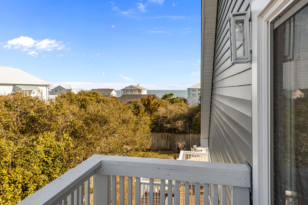 Enjoy multiple spacious balconies with comfortable seating, perfect for sipping your morning coffee or unwinding after a day at the beach