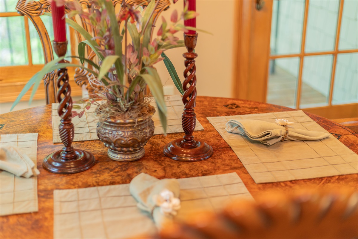 Thoughtful details make every meal feel special, from the decorative placemats to the neatly rolled cloth napkins waiting at the table.