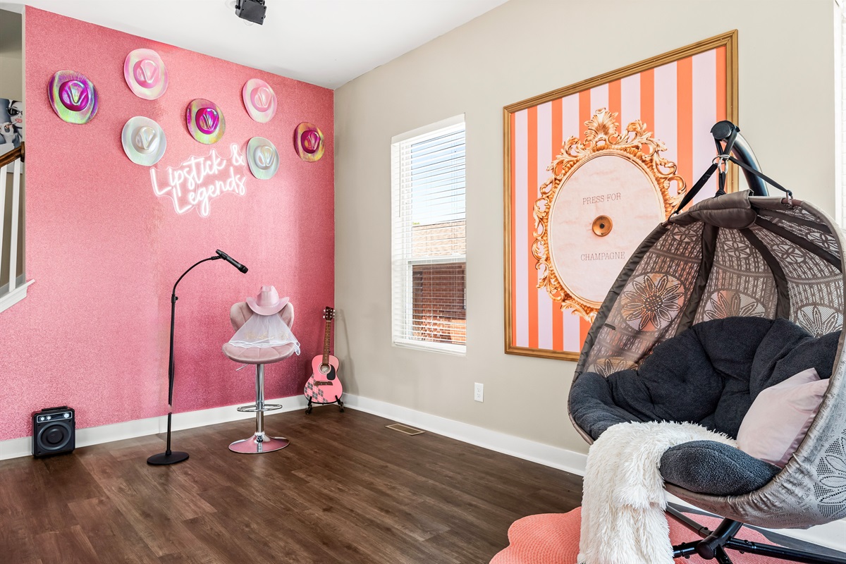 Pink glitter wall, disco light & karaoke machine.