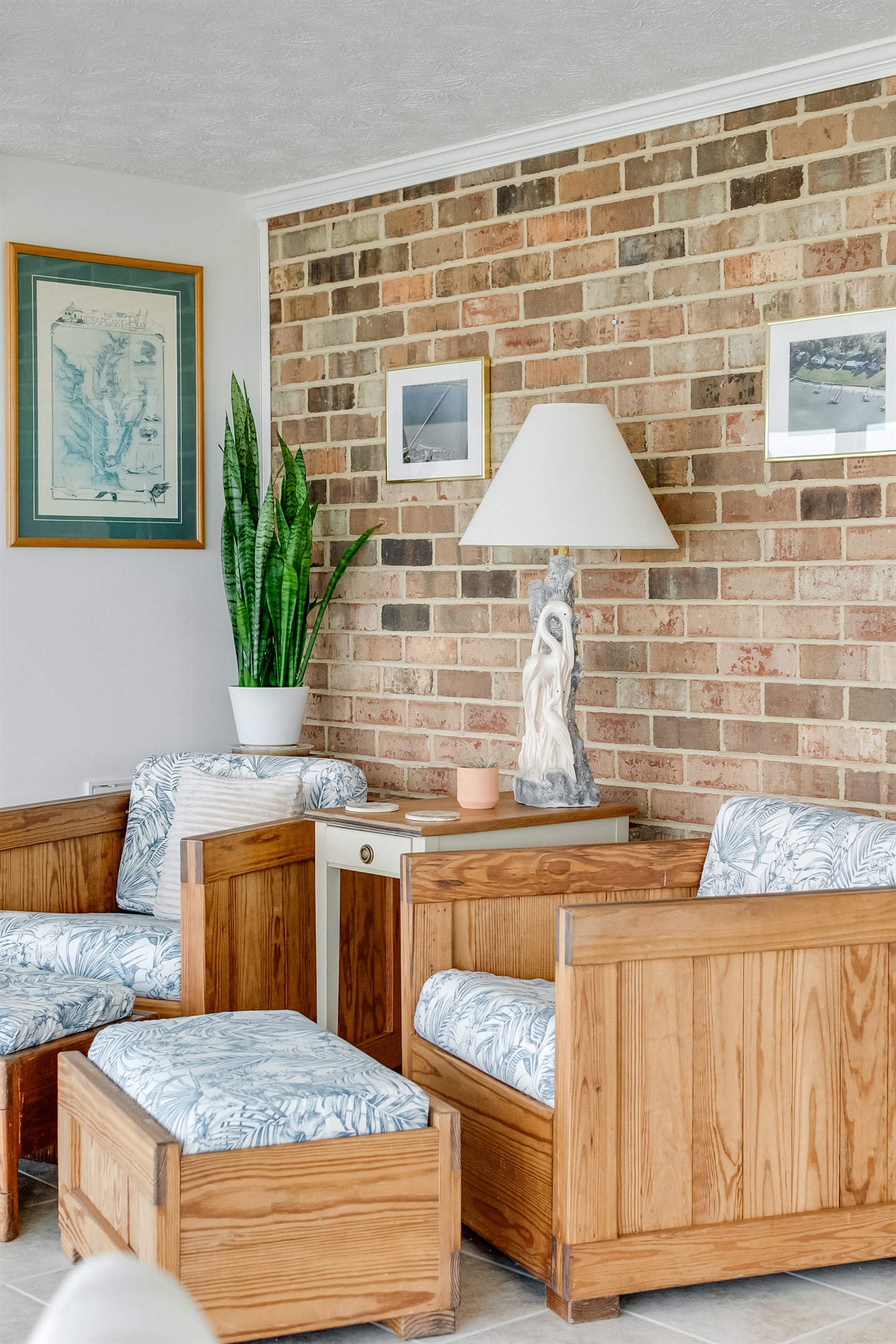 Living Room: Relax in style with vibrant decor, natural light, and a charming brick backdrop!