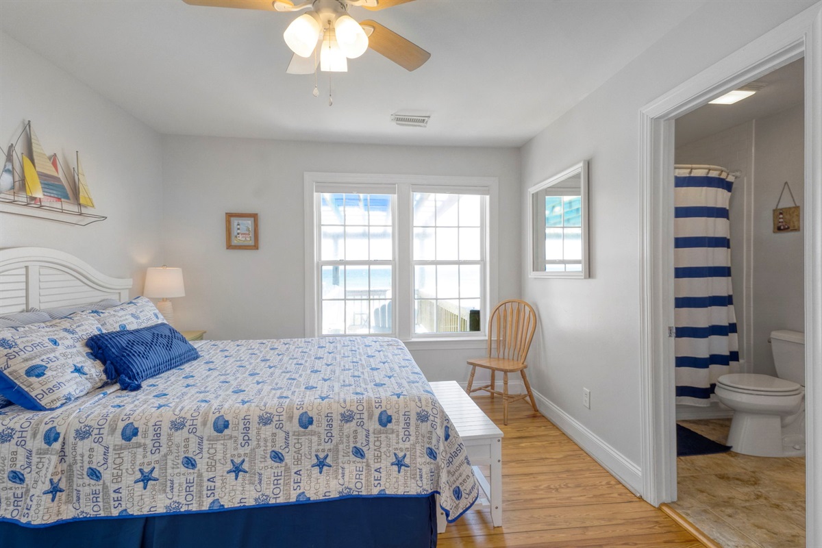 The queen bedroom with en suite bathroom has excellent views of the beach and ocean.